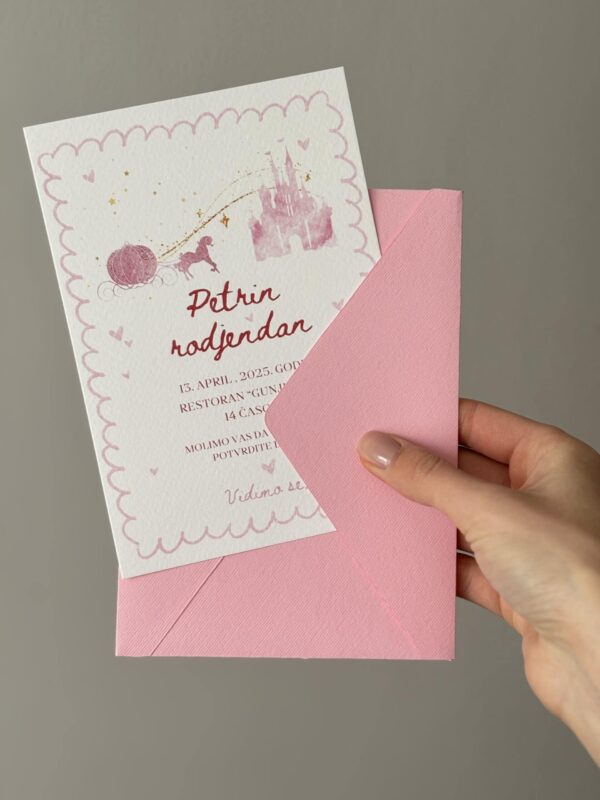 Elegant pink invitation card with a matching envelope for special events.