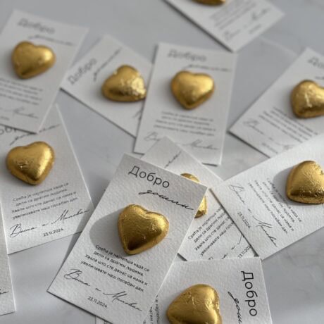 Golden heart-shaped chocolates on thank you cards with "Добро" written on them, celebrating gratitud.