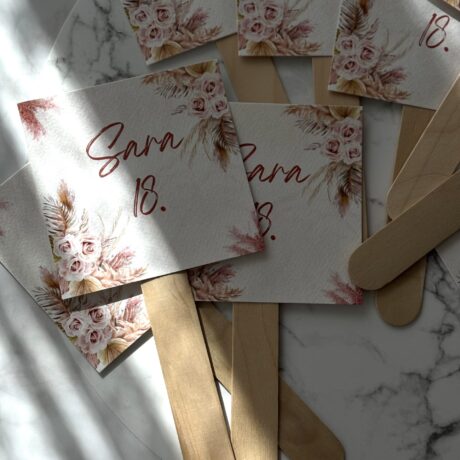 Elegant wedding invitations with floral design and wooden sticks, perfect for special occasions like.