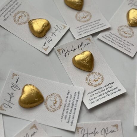 Golden heart-shaped chocolates on thank you cards for corporate appreciation.