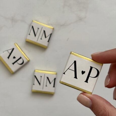 Personalized chocolate stamps with initials for custom chocolate decorations.