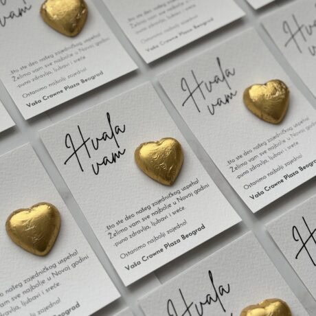 Heart-shaped chocolates on thank you cards for event appreciation.