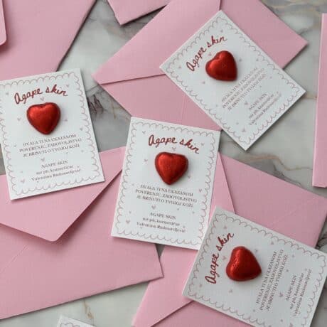 Personalized thank you cards with red heart embellishments for corporate gratitude.