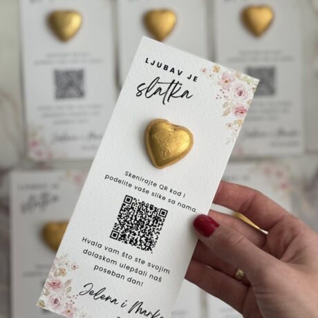 Golden heart-shaped gift tag with floral design, celebrating love and sweetness.