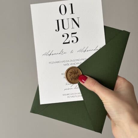 Elegant green wedding invitation with date and seal for a stylish wedding.