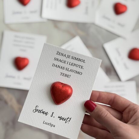 Heartfelt Women's Day card with red heart decoration for 8th March celebration.