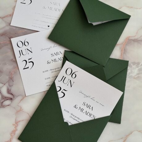 Elegant green wedding invitation with minimalist design and matching envelope for a stylish wedding.