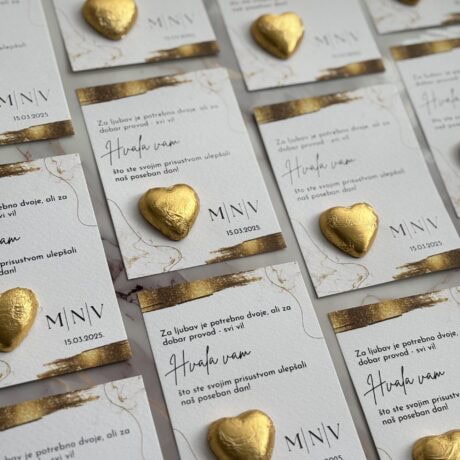 Golden heart-shaped chocolates on wedding invitations for Zahvalnica-Hvala vam 5 event.