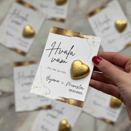 Elegant thank you card with gold heart embellishment for event appreciation.