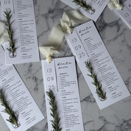 Fresh rosemary sprig on drink menu card for "Karta pića-ruzmarin" event, highlighting herbal garnish.