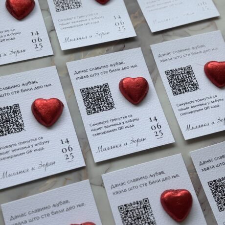 Personalized thank you notes with QR codes and red heart decorations.