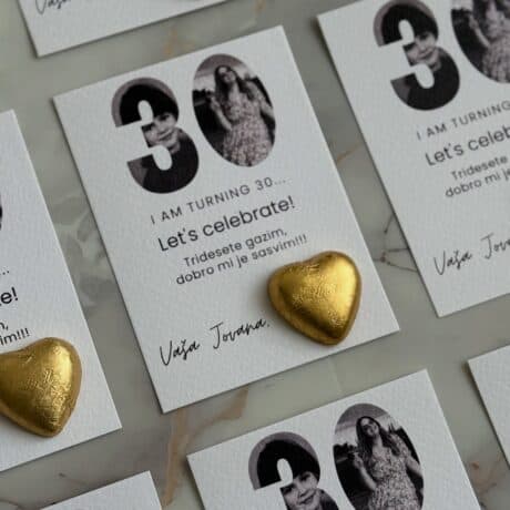 Celebration card for 30th birthday with black and white photos and gold heart embellishments.