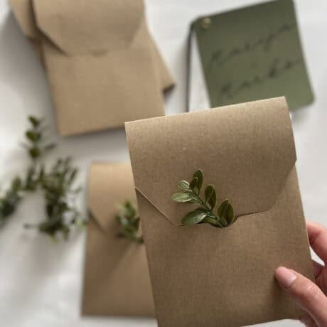 Eco-friendly kraft paper mailbox with green foliage accent, perfect for stylish and sustainable mail.