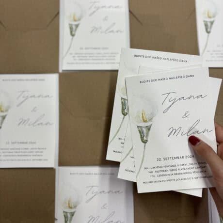 Elegant wedding invitation card for Tijana and Milan, featuring a candle illustration and event deta.