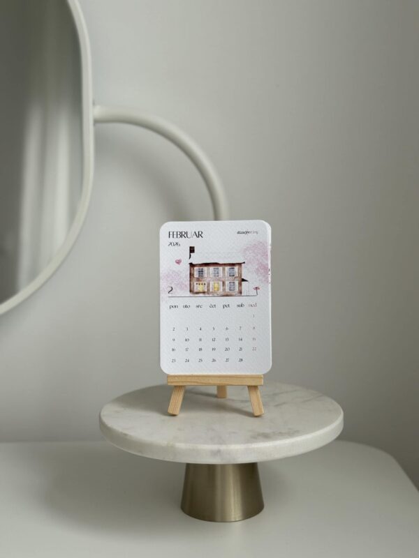 Colorful February 2026 house-themed desktop calendar on mini easel, modern home decor, minimalist style.