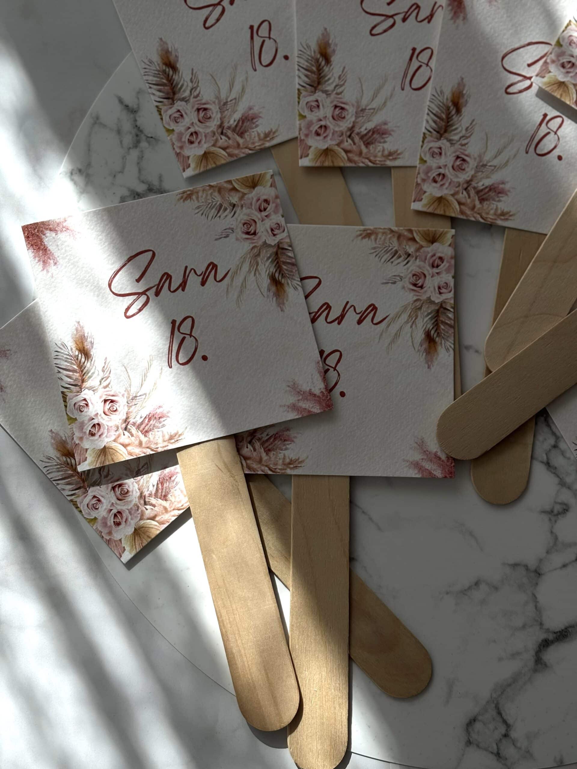 Elegant wedding invitations with floral design and wooden sticks, perfect for special occasions like.