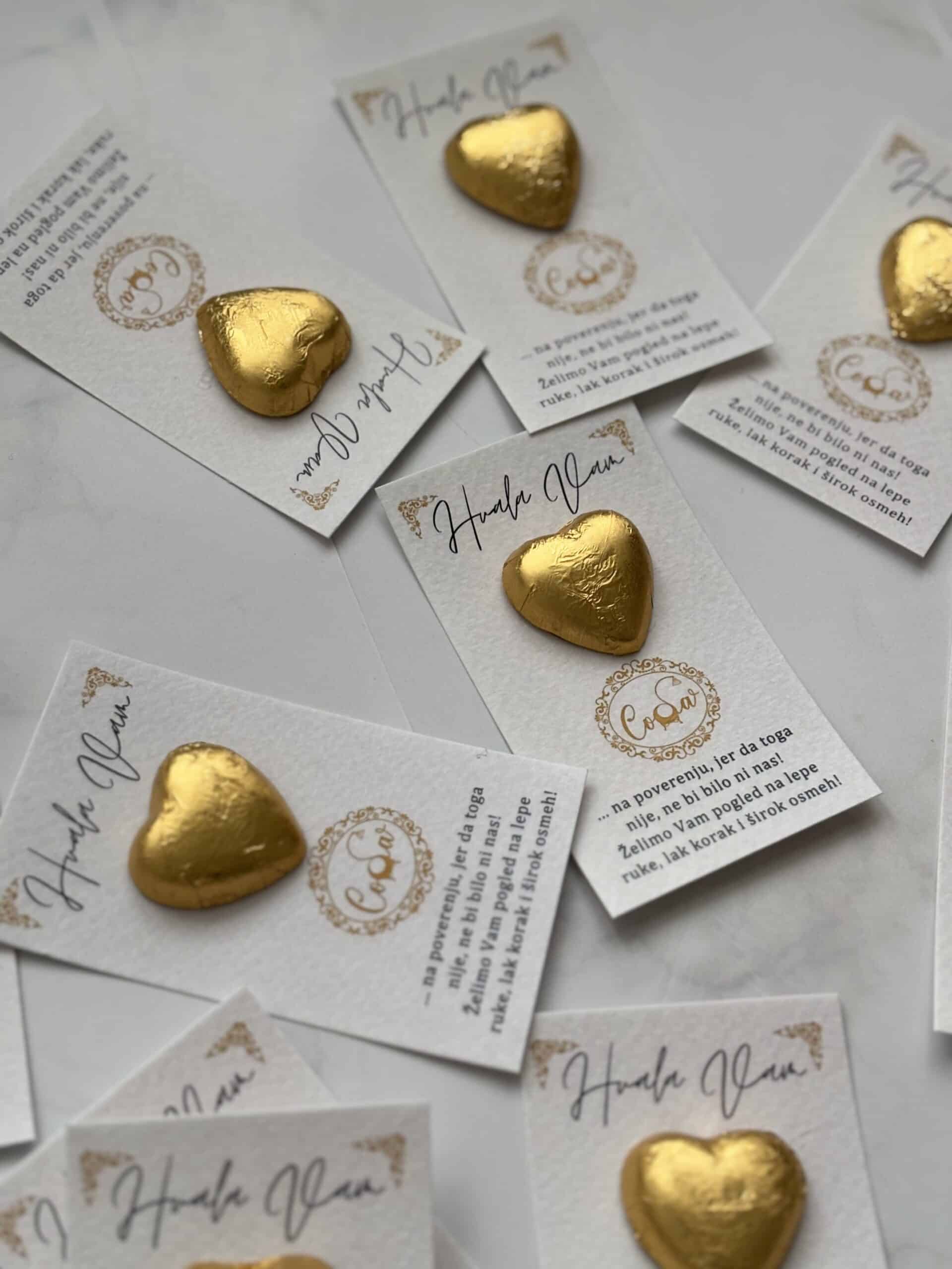 Golden heart-shaped chocolates on thank you cards for corporate appreciation.