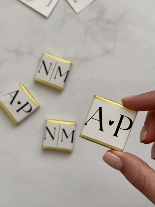 Personalized chocolate stamps with initials for custom chocolate decorations.