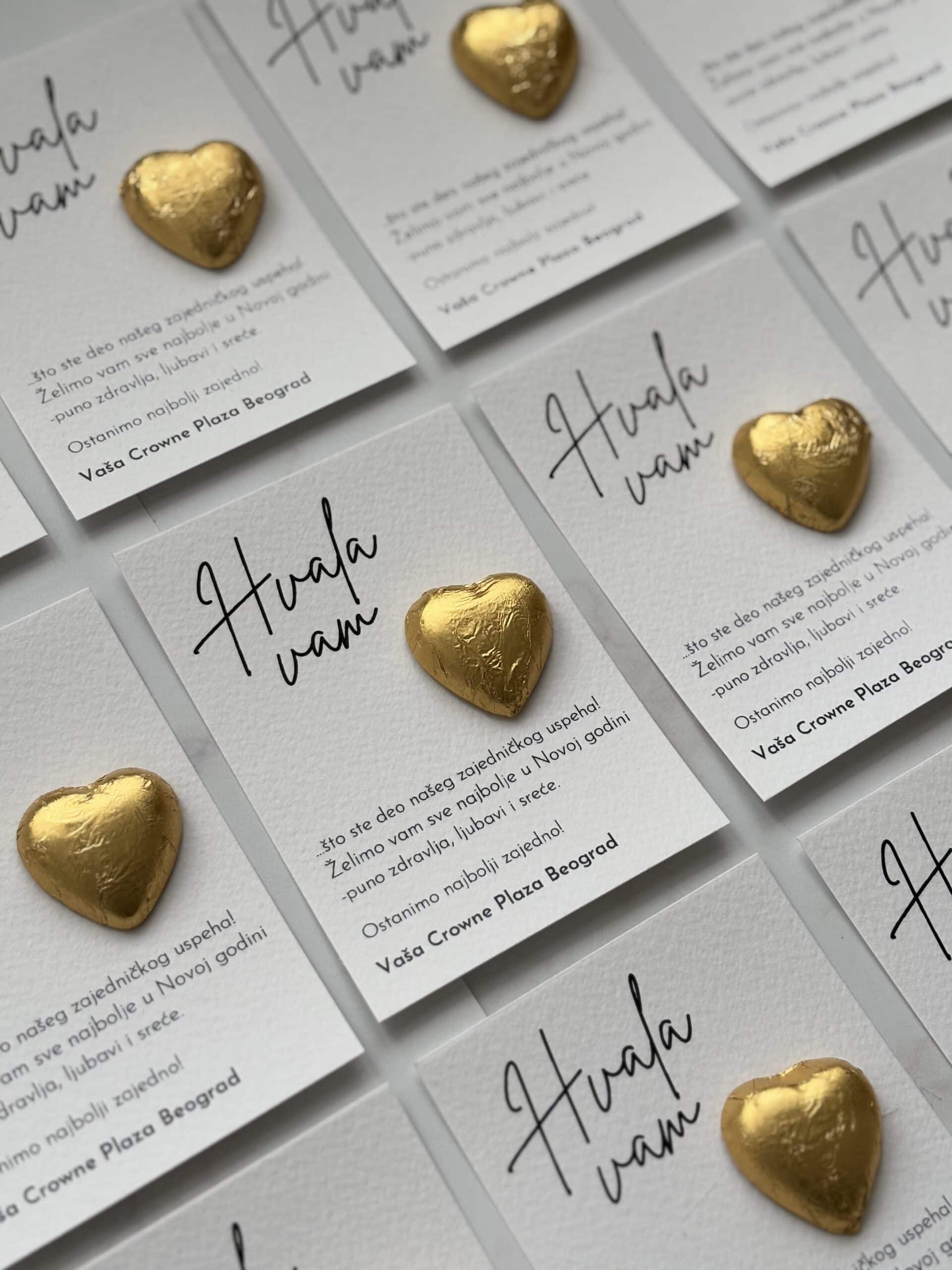 Heart-shaped chocolates on thank you cards for event appreciation.