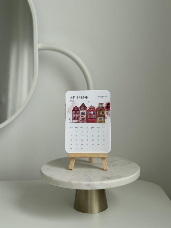 Miniature desk calendar showcasing modern interior decor and creative home design.