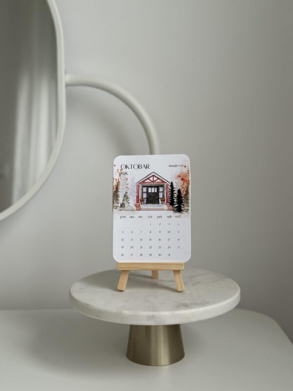 Decorative desk calendar with autumn-themed house illustration, minimalistic design, stylish tabletop decor, home interior accessory.