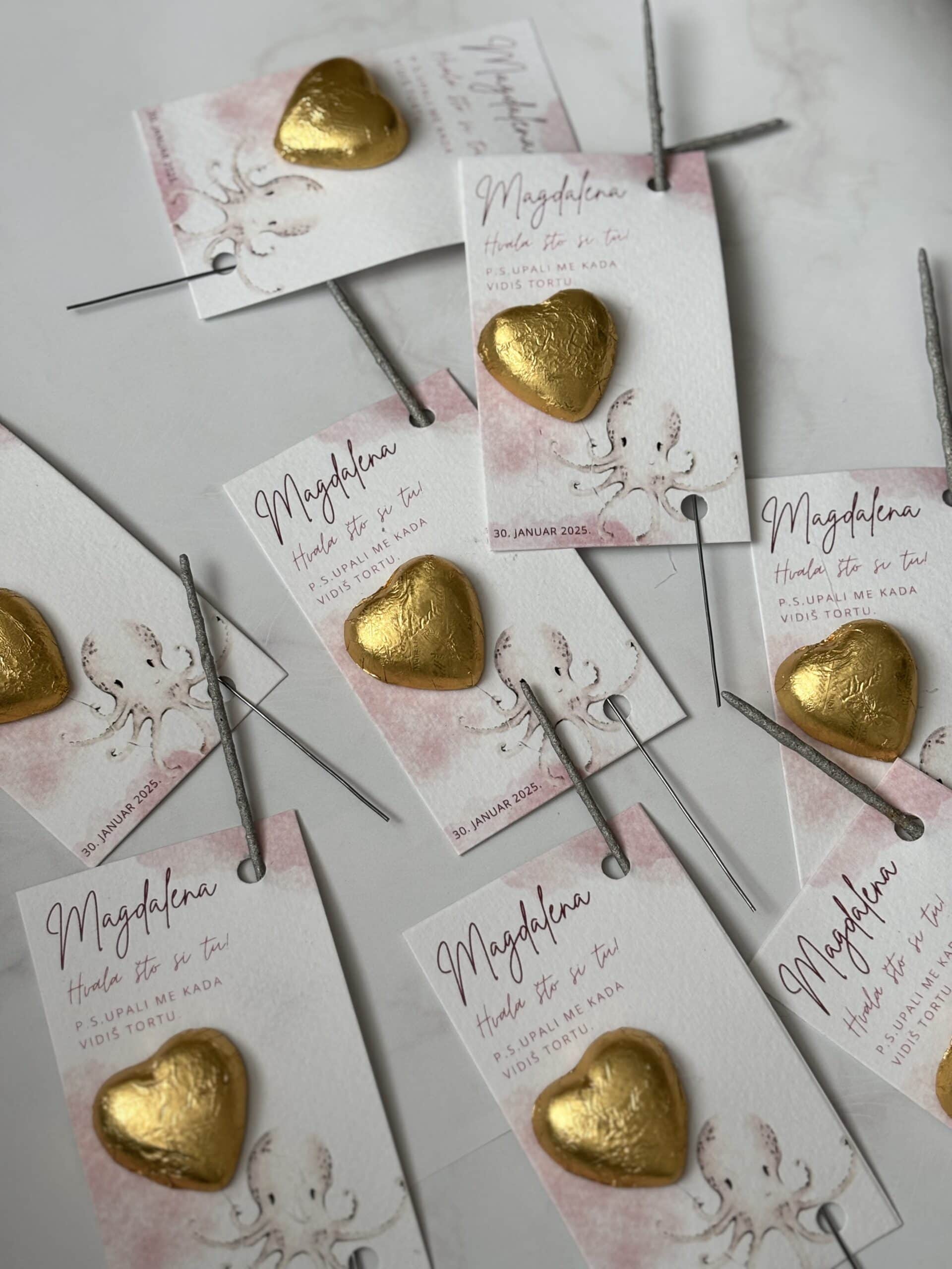 Chocolate heart wedding favors with personalized tags for "Zahvalnica M65" event.