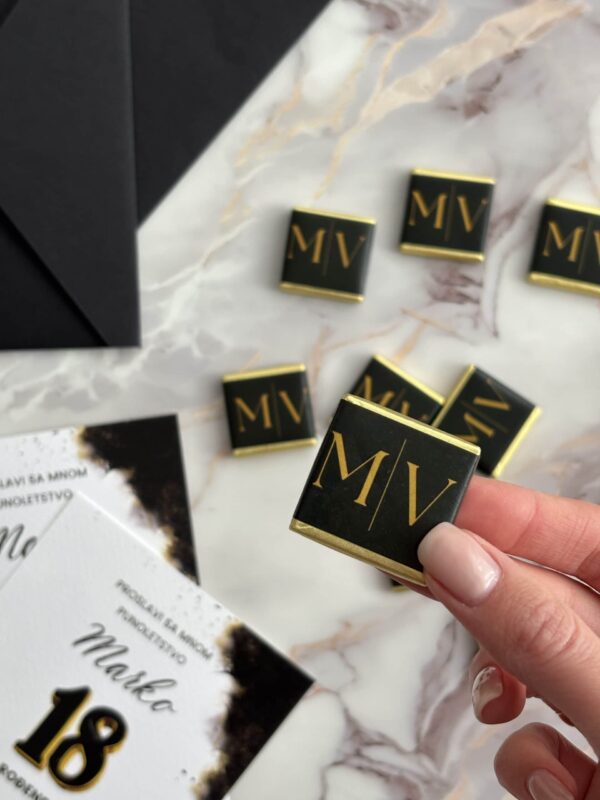 Elegant personalized chocolate favors with gold initials for special occasions.