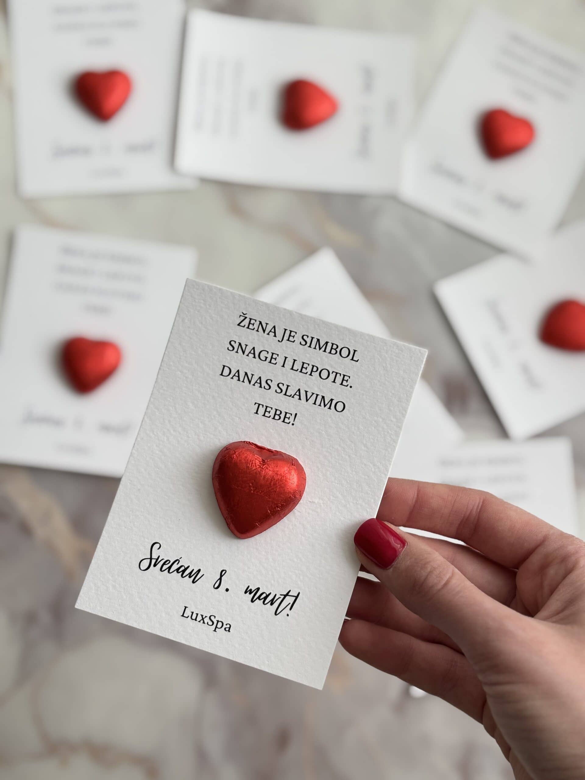 Heartfelt Women's Day card with red heart decoration for 8th March celebration.