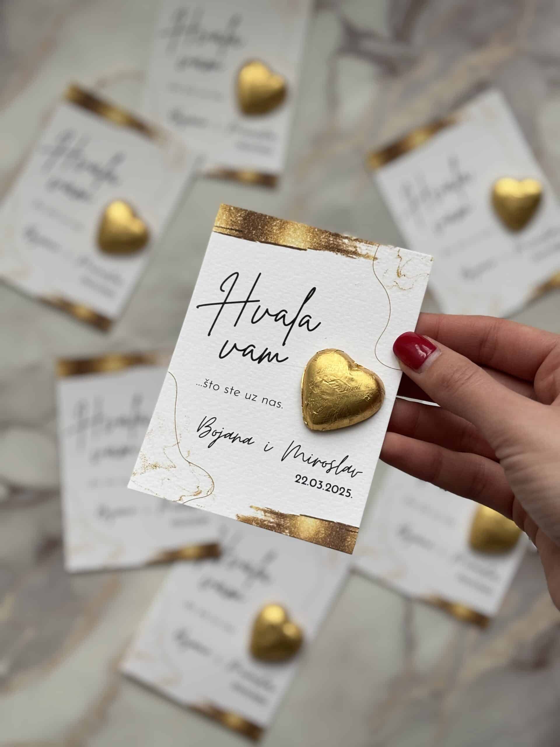Elegant thank you card with gold heart embellishment for event appreciation.