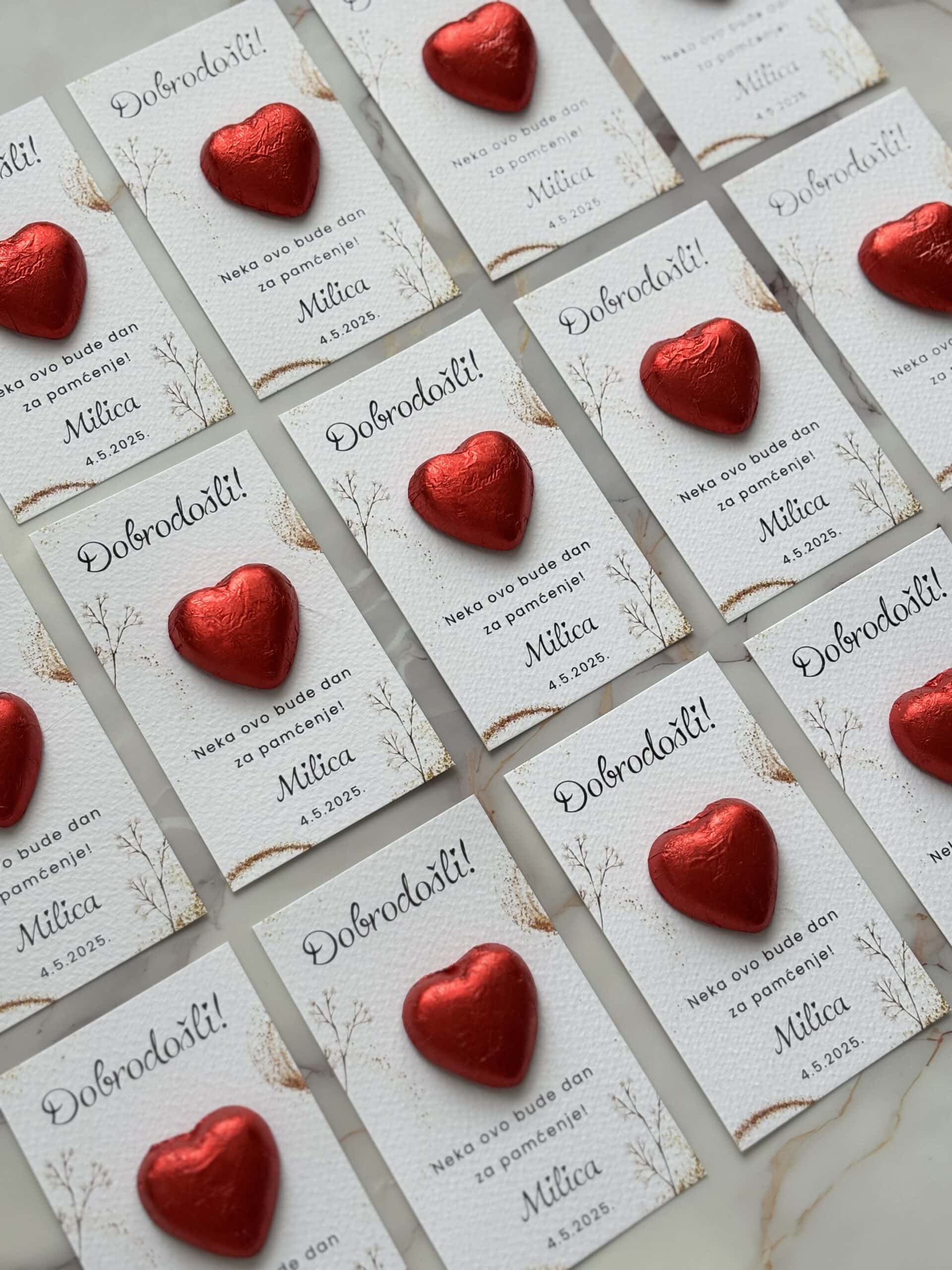Heart-shaped chocolates with personalized thank you notes for wedding guests.
