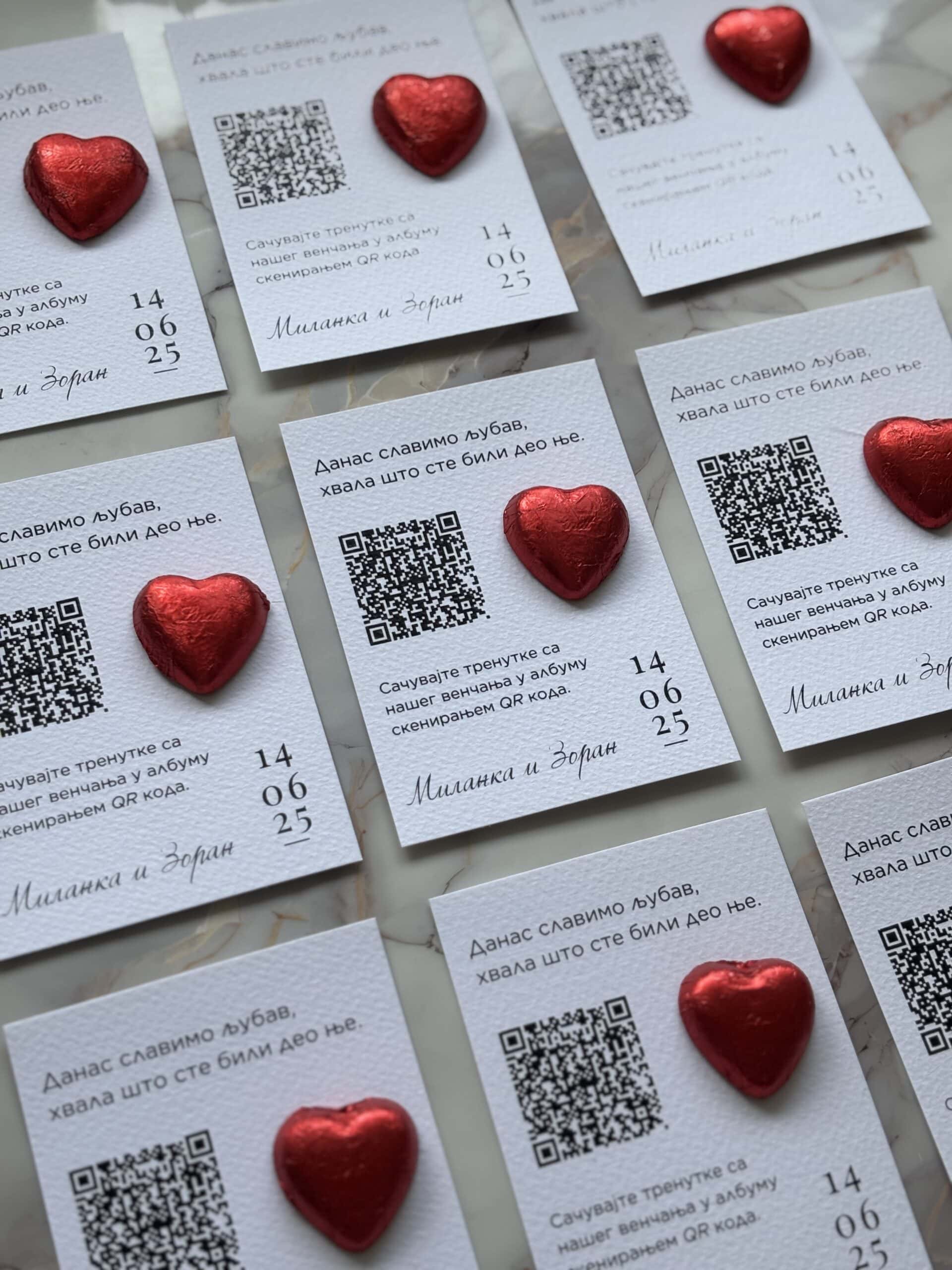 Personalized thank you notes with QR codes and red heart decorations.