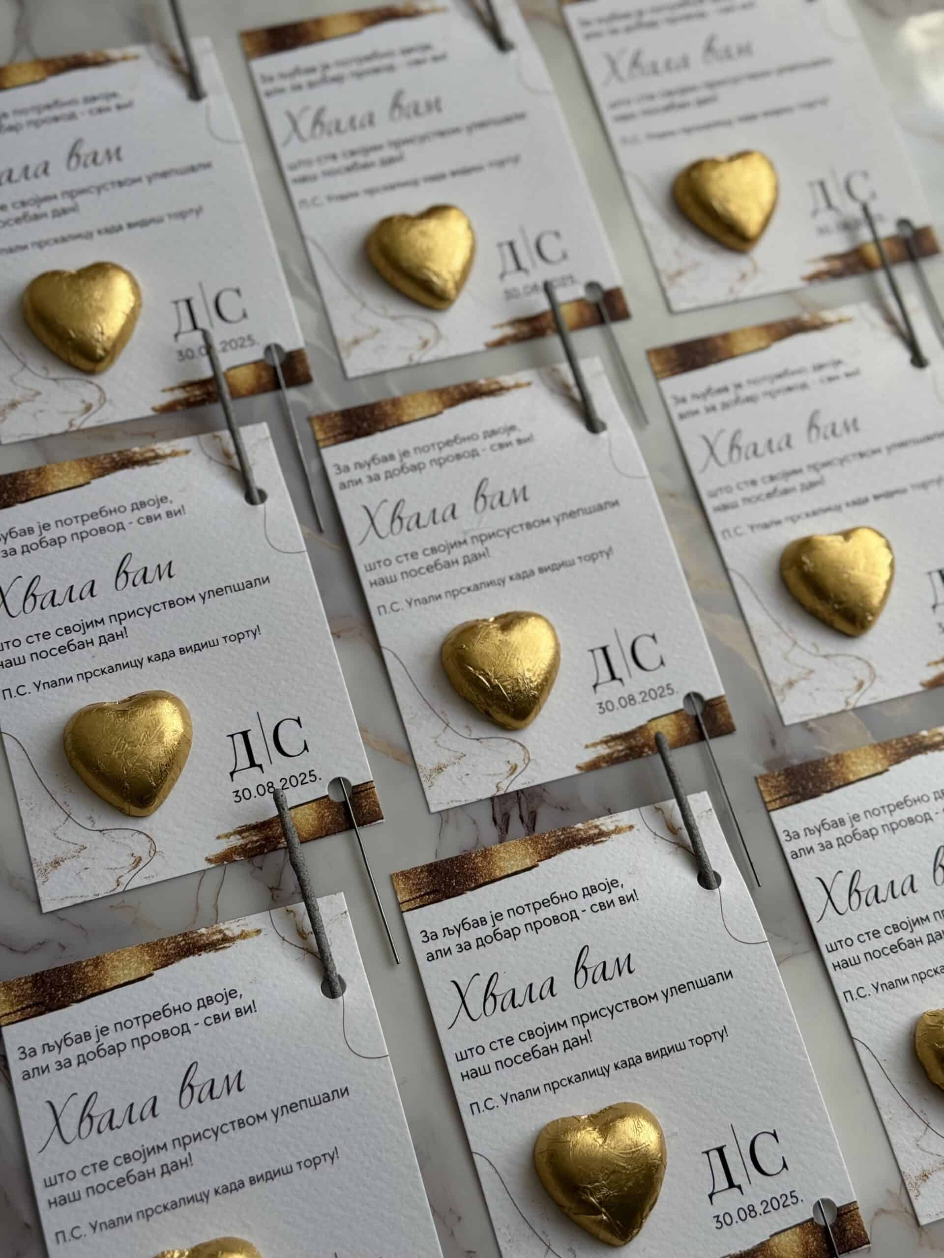 Gold heart-shaped chocolates on thank you notes for special occasions.