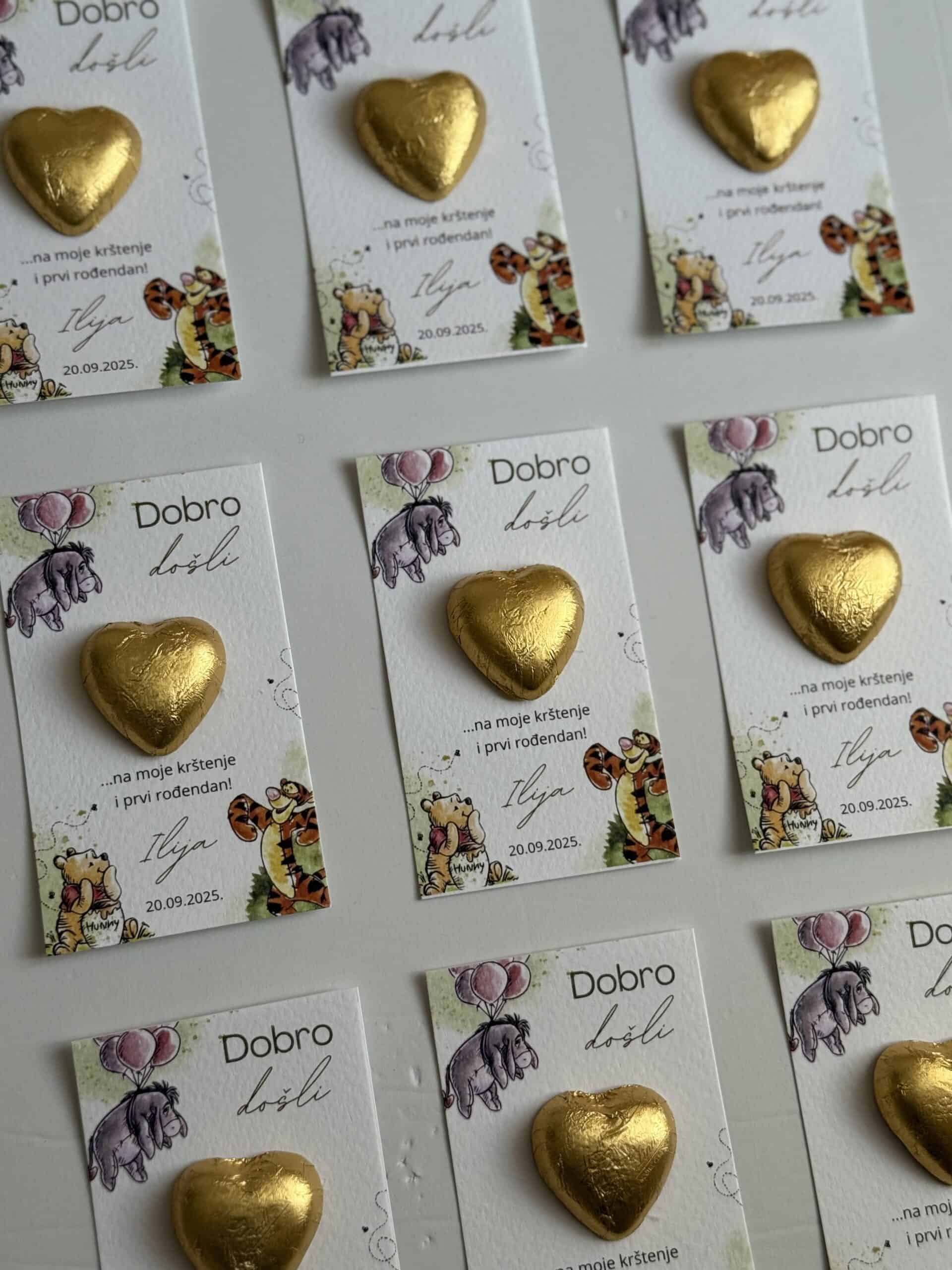 Heart-shaped gold chocolate on thank you card.