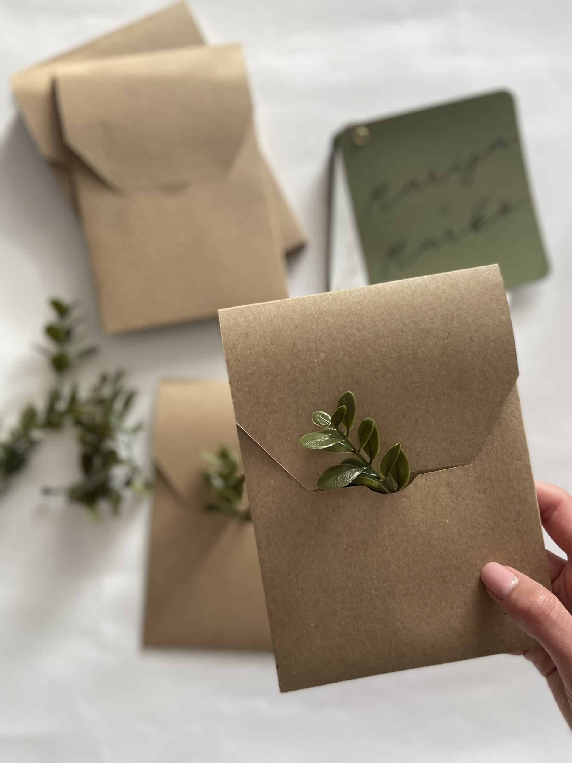 Eco-friendly kraft paper mailbox with green foliage accent, perfect for stylish and sustainable mail.