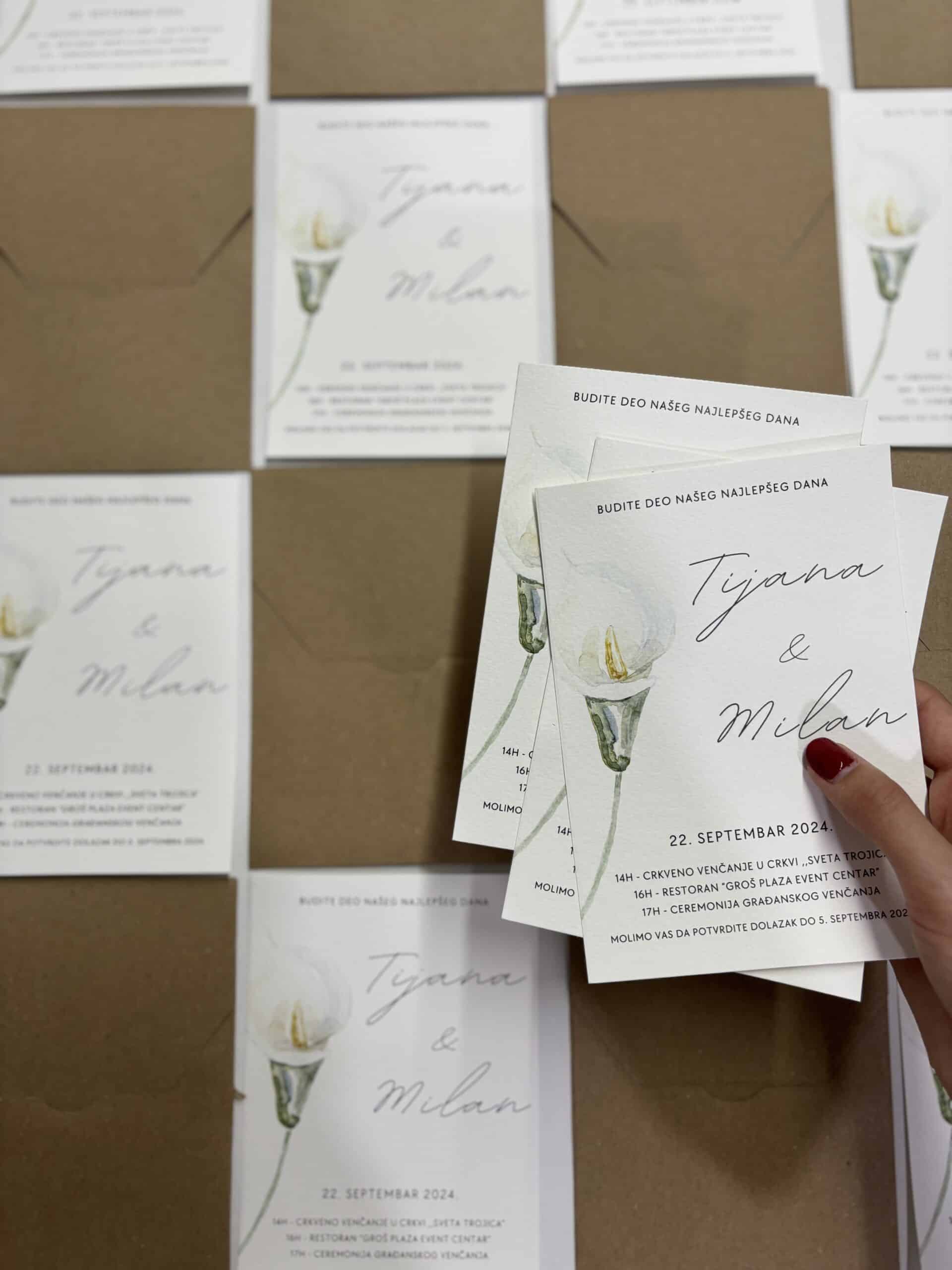 Elegant wedding invitation card for Tijana and Milan, featuring a candle illustration and event deta.