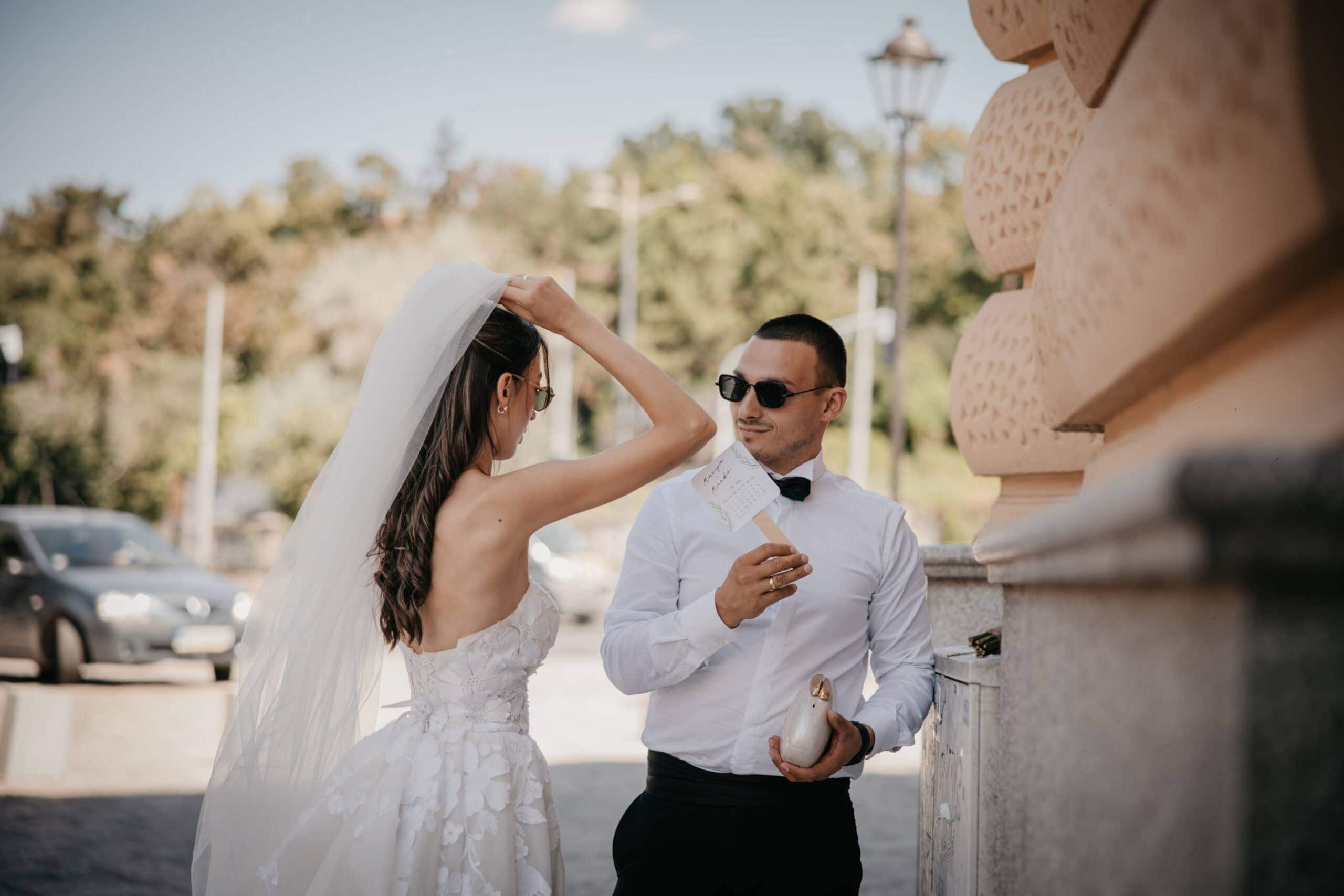 Elegant bride and groom sharing a moment outdoors during wedding celebration.